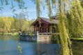 Chinese Garden of the Reclaimed Moon. Lake with tea house Royalty Free Stock Photo