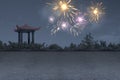 Chinese gazebo building on the park with fireworks Royalty Free Stock Photo