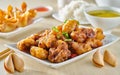 Chinese general tsos chicken meal with crab rangoon and egg drop soup Royalty Free Stock Photo