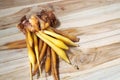 Chinese Ginger root, Galingale on wooden background, top view Royalty Free Stock Photo