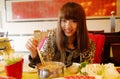 Chinese girl eating hot pot Royalty Free Stock Photo