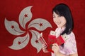 Chinese girl with envelope and flag of Hong Kong Royalty Free Stock Photo