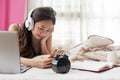 Chinese girl play smartphone on bed Royalty Free Stock Photo