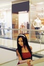 Chinese girl in shopping mall. Royalty Free Stock Photo