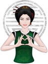 Chinese girl showing heart by fingers Royalty Free Stock Photo