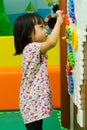 Chinese girl solving puzzle Royalty Free Stock Photo
