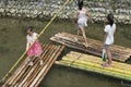 Chinese girls on bamboo raft