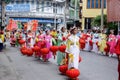 Chinese girls dressed as as a lanterns angel dancer in the parade of respect the Chinese gods