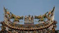 Chinese god sculpture on roof top of chinese temple Royalty Free Stock Photo