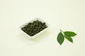 Chinese green tea. Milk Oolong Tea. Lemon leaf. Isolated in a white bowl on a white background Royalty Free Stock Photo