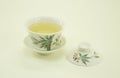 Chinese green tea. Milk Oolong Tea. Green tea in a beautiful traditional oriental cup with saucer. Isolated on a white background Royalty Free Stock Photo