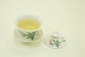 Chinese green tea. Milk Oolong Tea. Green tea in a beautiful traditional oriental cup with saucer. Isolated on a white background Royalty Free Stock Photo