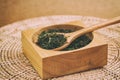 Chinese green tea in the wooden spoon Royalty Free Stock Photo