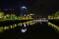 Chinese Guangzhou night illuminated cityscape with modern buildings and a river
