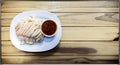 Chinese Hainan Styled Chicken Over Rice on a Wooden Background