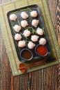 Chinese Har Gow Dim Sum dumplings in the shape of a bonnet served with sauce. Vertical top view Royalty Free Stock Photo