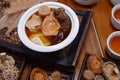 Chinese Herb Soup with wood background Royalty Free Stock Photo