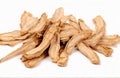 Chinese Herbal medicine - American Ginseng slices, cut out on white background Royalty Free Stock Photo
