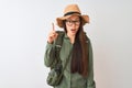 Chinese hiker woman wearing canteen hat glasses backpack over isolated white background pointing finger up with successful idea Royalty Free Stock Photo