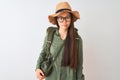 Chinese hiker woman wearing canteen hat glasses backpack over isolated white background skeptic and nervous, frowning upset