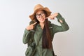 Chinese hiker woman wearing canteen hat glasses backpack over isolated white background smiling cheerful showing and pointing with Royalty Free Stock Photo