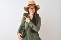 Chinese hiker woman wearing canteen hat glasses backpack over  white background cheerful with a smile of face pointing Royalty Free Stock Photo