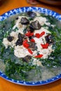 A Chinese home-cooked dish with wolfberry leaves in soup Royalty Free Stock Photo