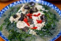 A Chinese home-cooked dish with wolfberry leaves in soup Royalty Free Stock Photo