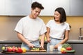 Chinese Husband And Wife Cooking Vegetable Salad In Modern Kitchen Royalty Free Stock Photo