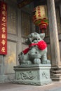 Chinese Imperial guardian lion, made of stone, guarding the gate at a buddhist temple in Saigon, Vietnam Ho Chi Minh City Royalty Free Stock Photo