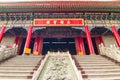 Chinese incense burner and stairs in front of traditional temple