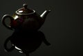 Chinese jug with a mirror image on a black background Royalty Free Stock Photo