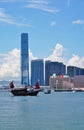 A Chinese junk ship in front of the Hong Kong skyline Royalty Free Stock Photo