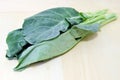 Chinese Kale or Chinese Broccoli vegetable on wood back Royalty Free Stock Photo
