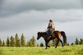 Chinese Kazakh herdsmen riding horse in grasslan