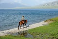 Chinese Kazakh herdsmen riding horse at Sailimu