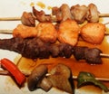 Chinese kebab on a white plate in Asian restaurant Royalty Free Stock Photo