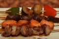 Chinese kebab on a white plate in Asian restaurant Royalty Free Stock Photo