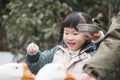 Chinese kid feeding goose