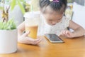 Chinese kid harmful lifestyle: smartphone and more sugar drink Royalty Free Stock Photo