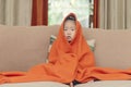 Chinese kid portrait covered by red towel