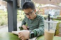 Chinese kid reading in beverage store Royalty Free Stock Photo