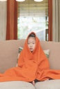Chinese kid portrait covered by red towel