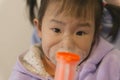 Chinese kid taking Inhalation therapy Royalty Free Stock Photo