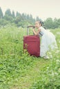 Chinese kid on trip with travel suitcase