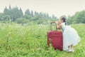 Chinese kid on trip with travel suitcase