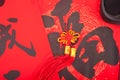 A Chinese knot hanging on the red spring festival couplets with Chinese characters Royalty Free Stock Photo