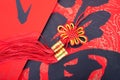 A Chinese knot hanging on the red spring festival couplets with Chinese characters Royalty Free Stock Photo