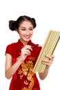 Chinese lady in cheongsam write a bamboo book by ink