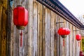 Chinese lanterns hanging on a wooden wall, Asian new year tradition Royalty Free Stock Photo